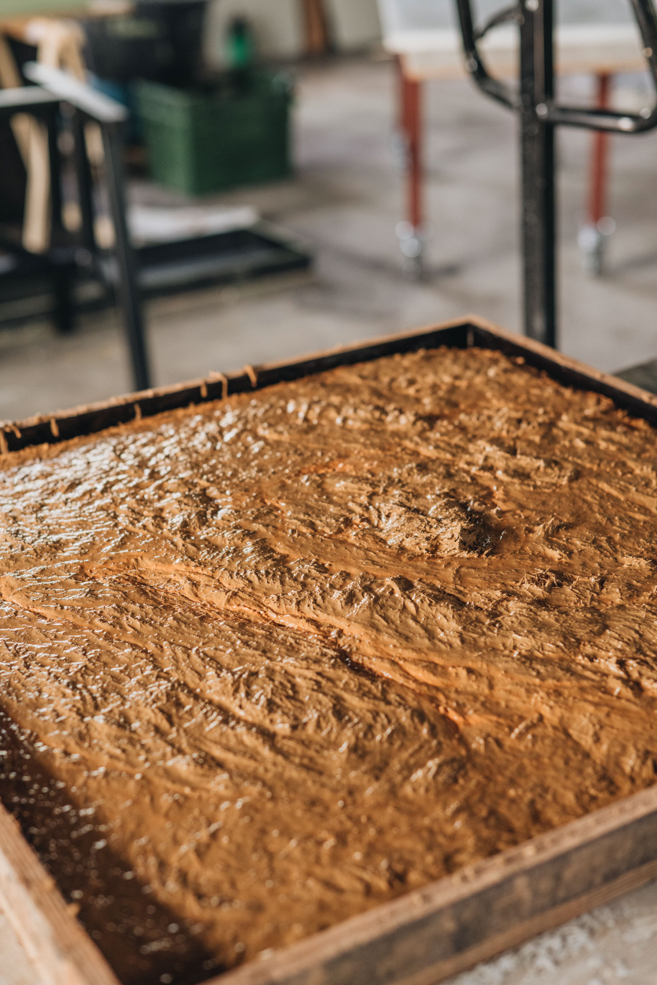 Wet clay in wooden frame